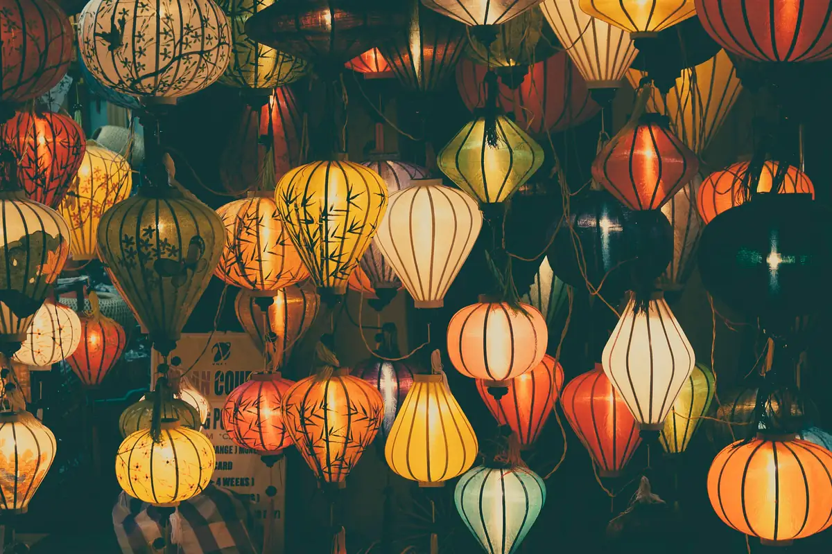 Rows of silk lanterns glowing at dusk