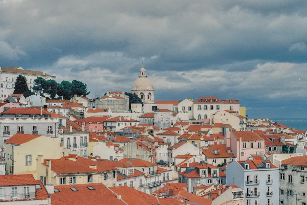 Red-tiled rooftops falling away towards the river