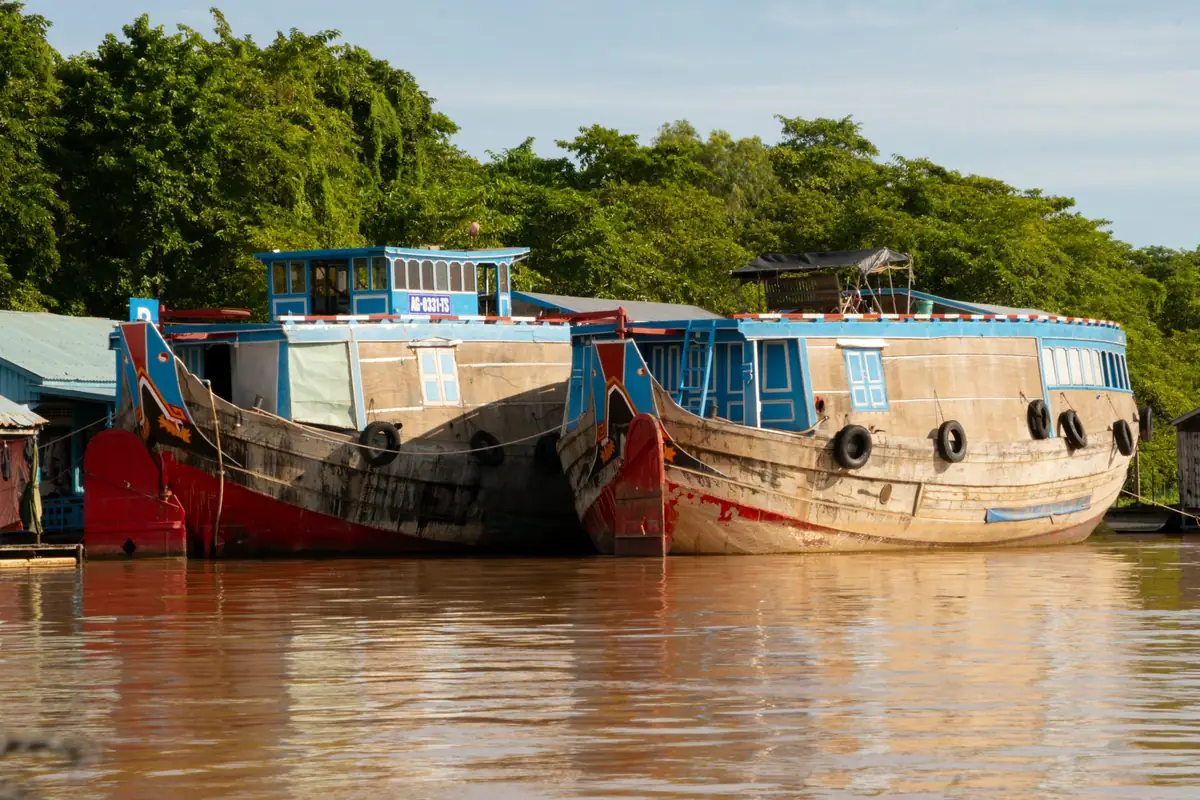 Two wooden boats tied up on the river